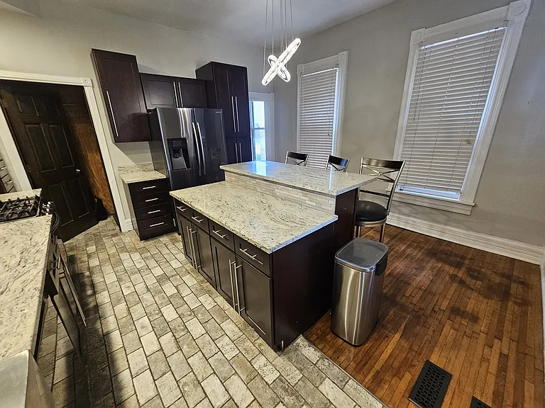 Large windows offer plenty of daylight the door in the left corner leads to a very large basement that has brand new washer/dryer.