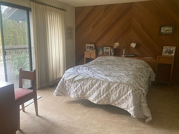 Master bedroom with slider to rear deck.