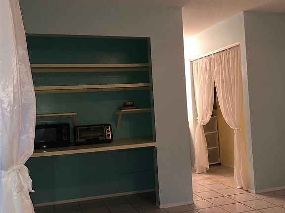 Lots of shelving for kitchenette; full -sized closet with drawers cart and overhead shelf for storage.