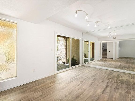 Dining room with mirrored wall.