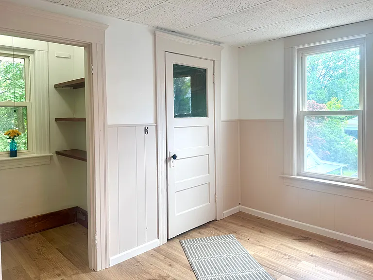 View of pantry and back door to mudroom and back porch.