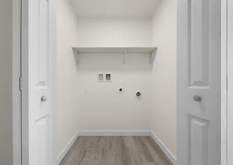 Laundry space on first floor with washer/dryer hook ups. Space is ready for your electric appliances.