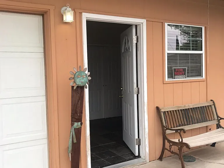 Front entrance and parking spot