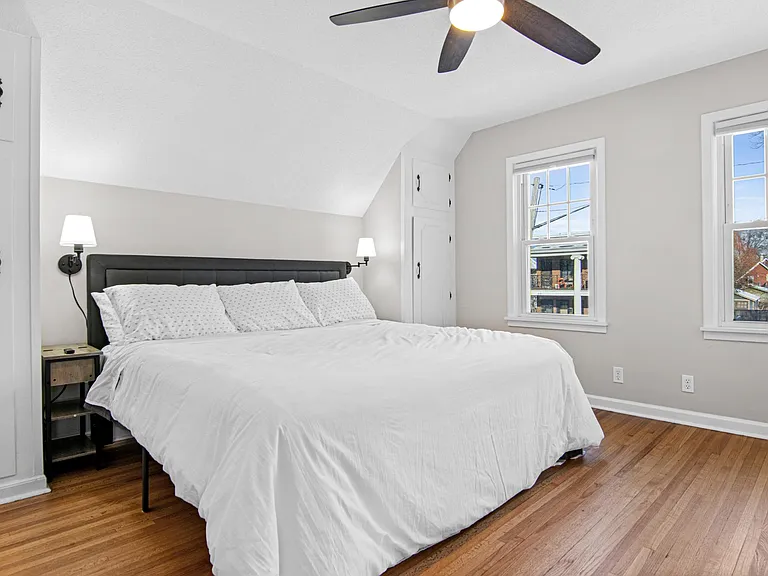 Master bedroom with three closets (2 smallest shown), and a ceiling fan
