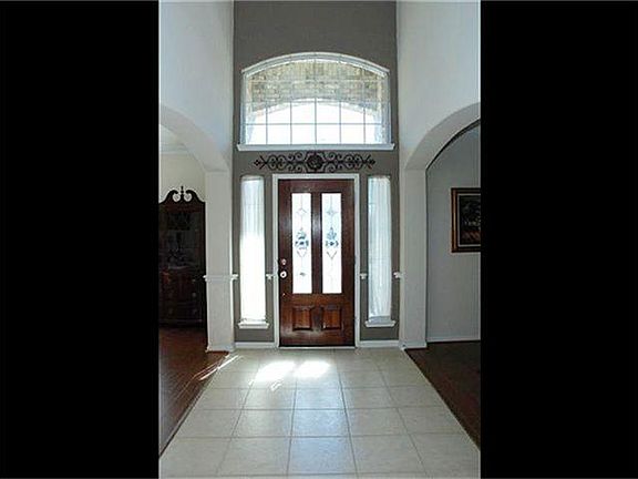 An inside view of this 2 story entry filled with natural light
