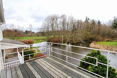 The view from this deck on a sunny day is of Mt. Rainier. The natural wetlands on this property are 