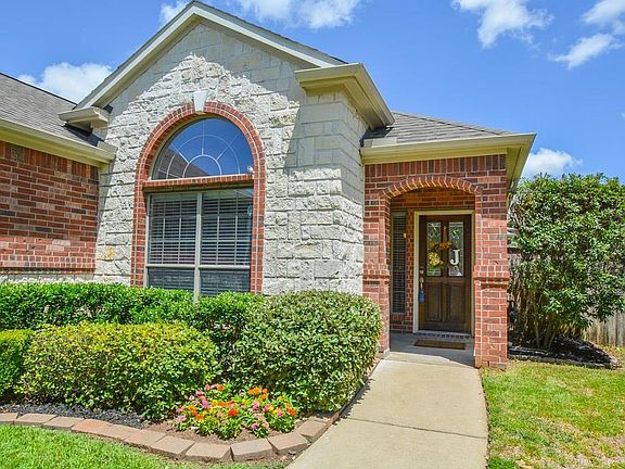 Front elevation accented with stone.