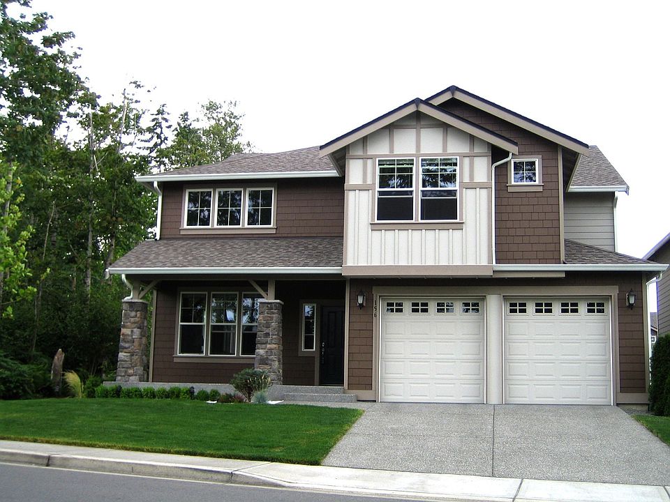 Front view of the house with greenbelt on the side