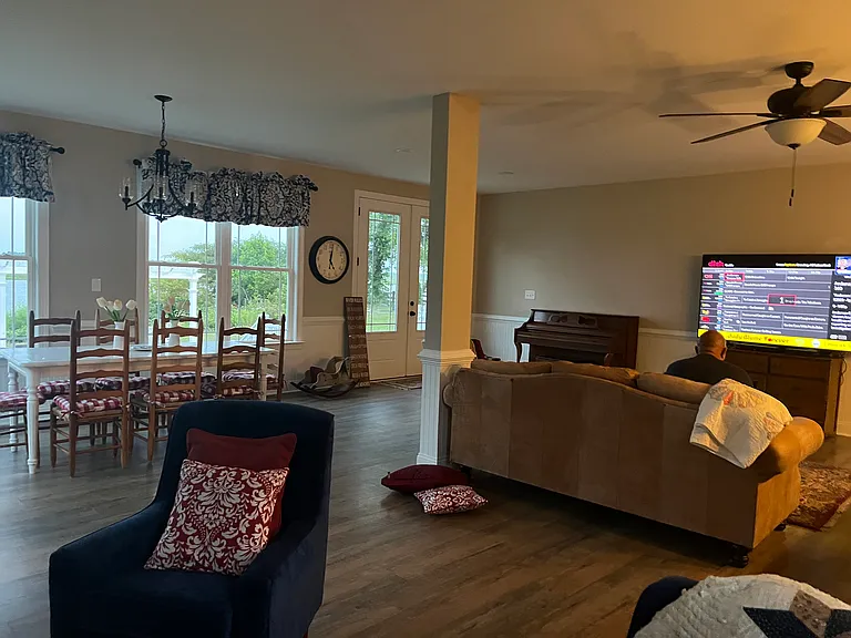Another view of the living room and large flat screen television.