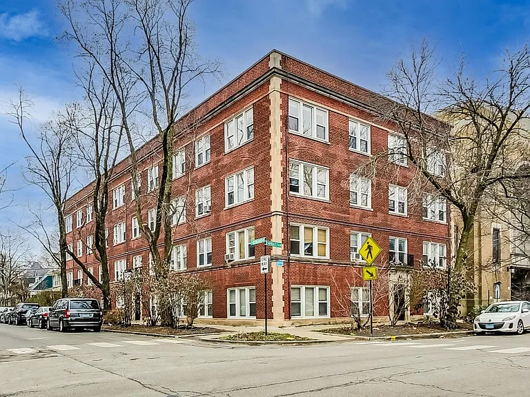 View of building on corner of Pratt and Newgard in Rogers Park. Apt is the second floor of this 3 floor building plus basement