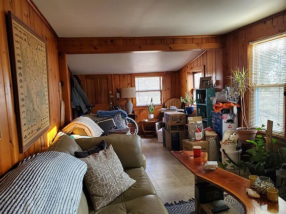 Beautiful real hardwood paneling on living room walls.