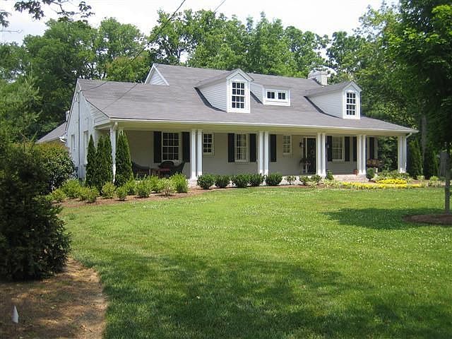 The front porch graciously welcomes guests and provides a shady place to relax