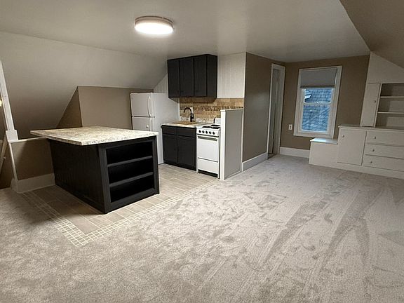newly updated Kitchen area with large island and seating. Tile floor
