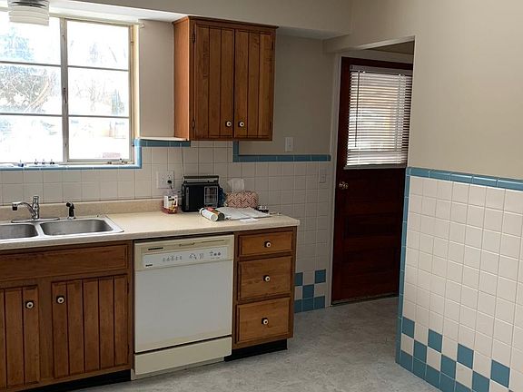 Kitchen with back door to covered patio