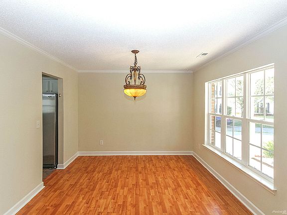 Formal dining room with crown molding