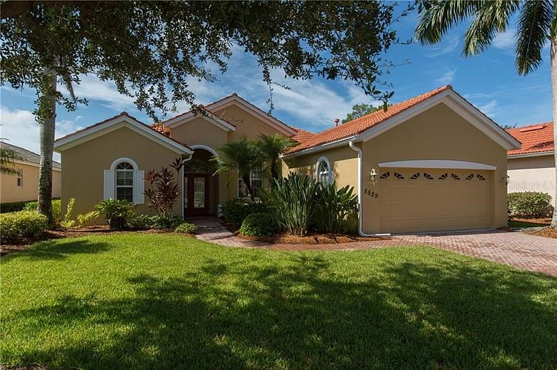 Custom Facia with brick driveway and walk.