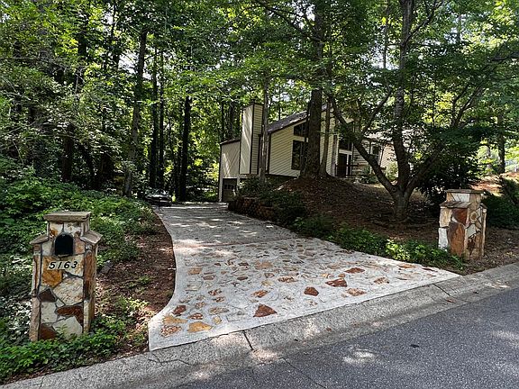 Entrance drive with stone columns.