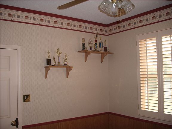 Office on main level with hardwood floor