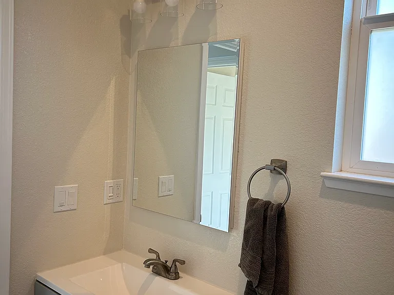 Full Bathroom 1 sink with mirror w/in wall storage
