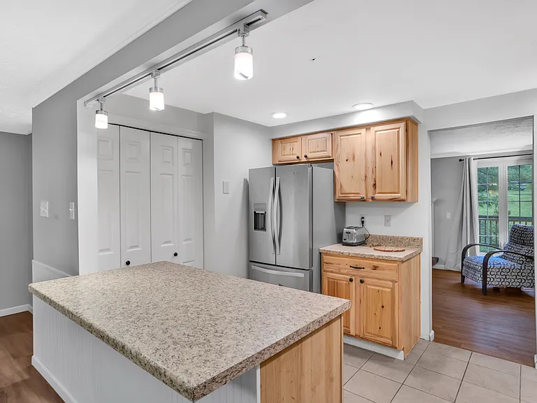 Kitchen with Large Island and Oversized Pantry.