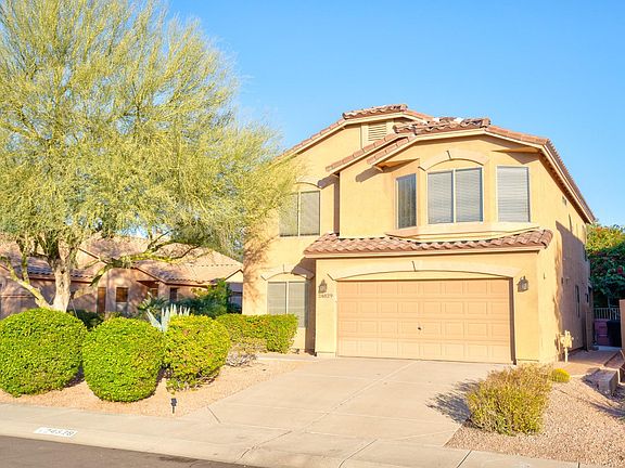 Front of property with two car garage recently just painted.