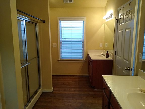 Master bathroom view from walk in closet. Large closet on left side front