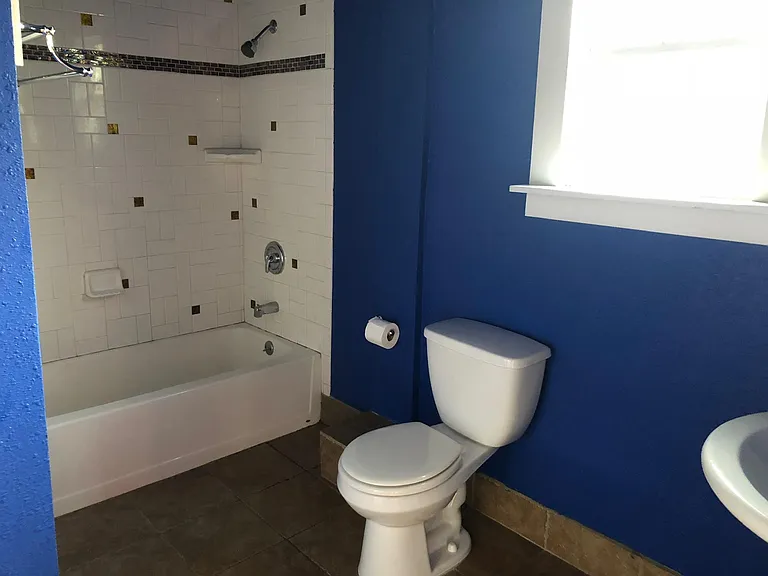 Bathroom downstairs (2 doors connect to bedroom downstairs and kitchen)