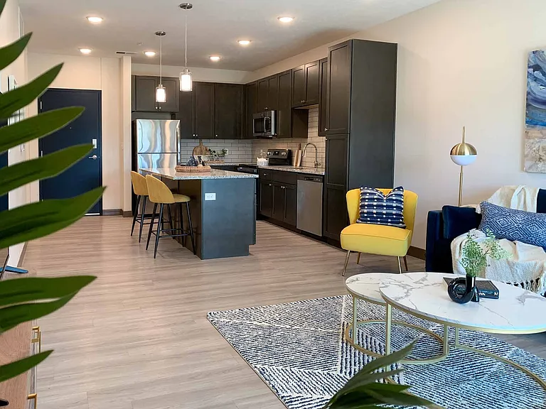 Enjoy the open-concept between your modern kitchen and cozy living room in our Marble floor plan.