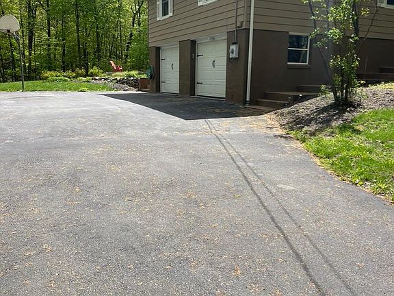 View coming up long driveway to the house.
