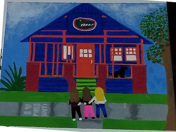 Our three former tenants in front of their college home. Painting complements of Noelle. :)