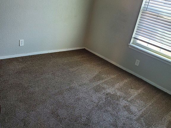 Upstairs bedroom with ceiling fan
