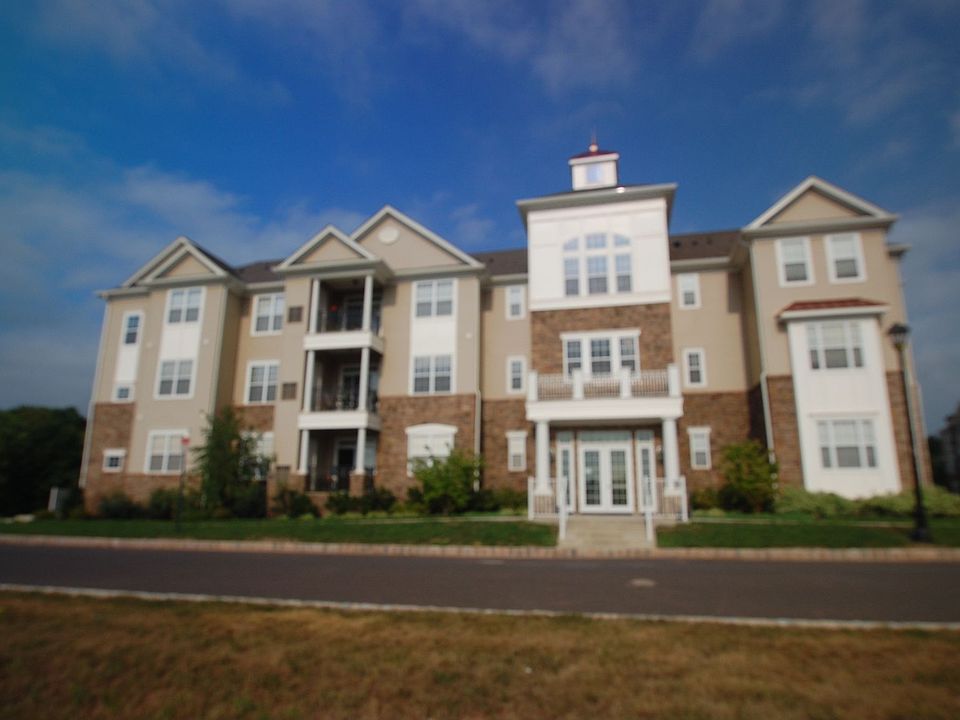 Front of Building -  3rd floor, end unit, 2 assigned parking spaces in garage