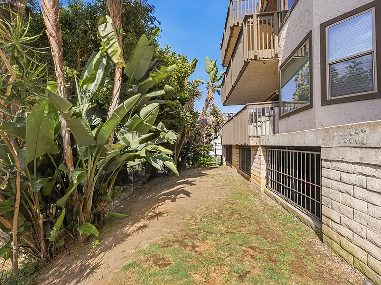 Fenced in area behind building for pets