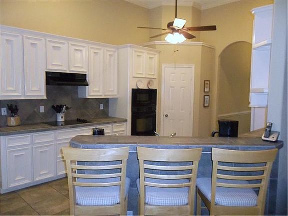 View of the kitchen and breakfast bar.