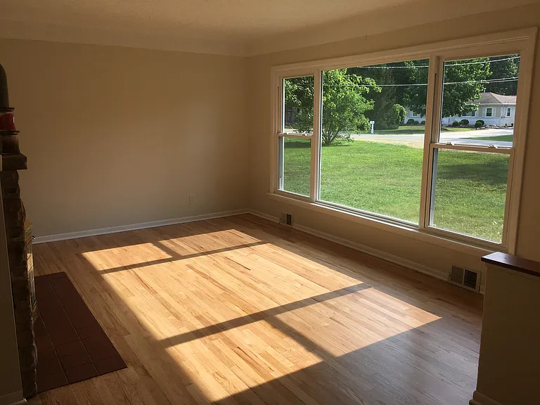 Living room includes large picture window to allow plenty of natural light.
