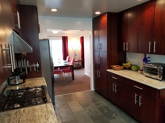 Large kitchen looking into the dining room with a view