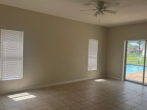 Family room with sliders to pool area