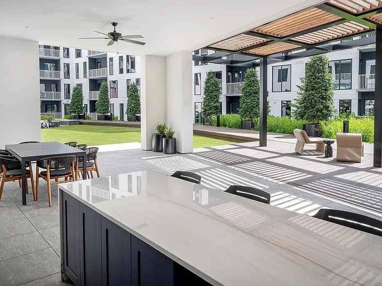 Courtyard greenspace connected to outdoor kitchen
