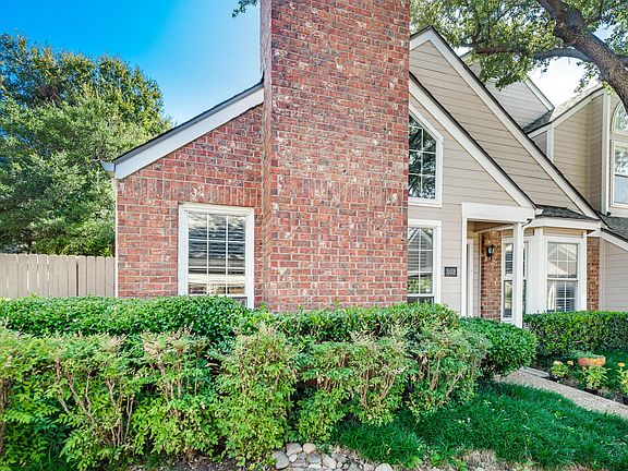 Side view of the home showing the enclosed, private patio