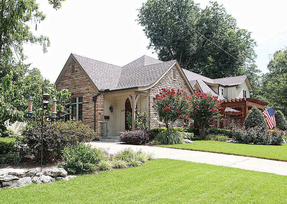 This English style home was built in 2008 in the original Brookside Addition. A circle drive allows access from either side of the corner lot.