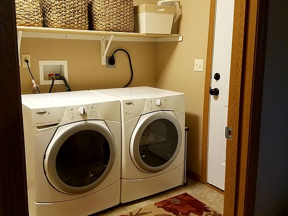 Laundry room with back door