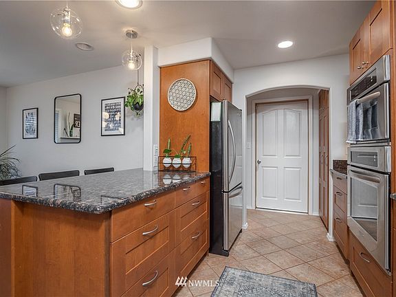 Kitchen connects to garage and laundry room. This home is wired for generator!