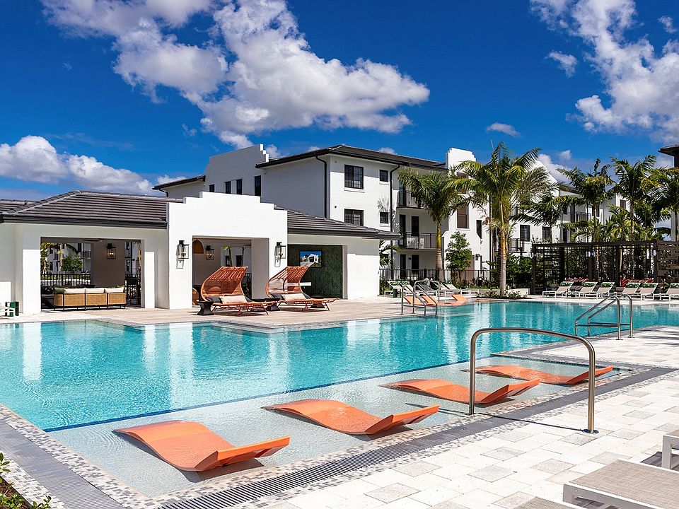 Relax by the shimmering pool at your new community