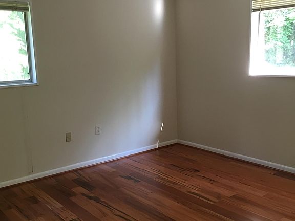 Sunny bedroom has both south and east facing windows plus ne