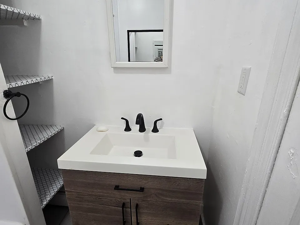 Bathroom vanity with storage shelves