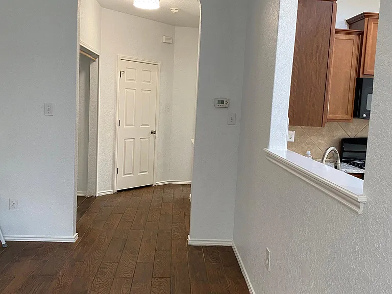 Open view to Kitchen from Family Room/hallway to laundry room and Master Bedroom
