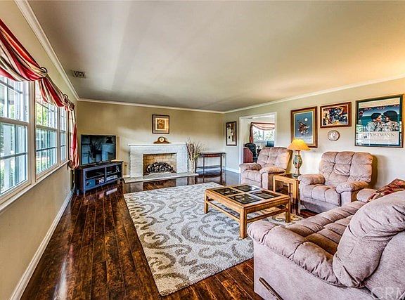Formal Living Room with painted brick fireplace