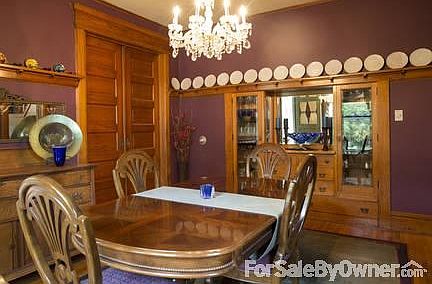 Dining Room
						:
						View of built-ins and 10 foot pocket doors.