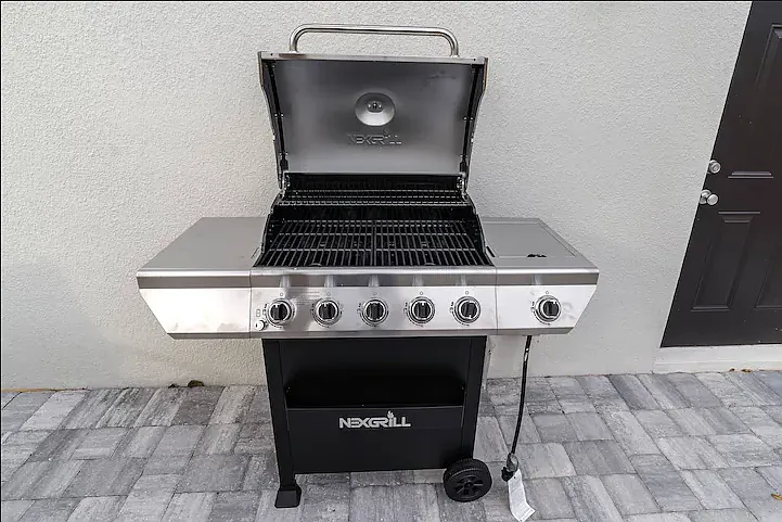 Close-up of the grill (grilling utensils available), showcasing a great spot for cooking up a barbecue feast.
