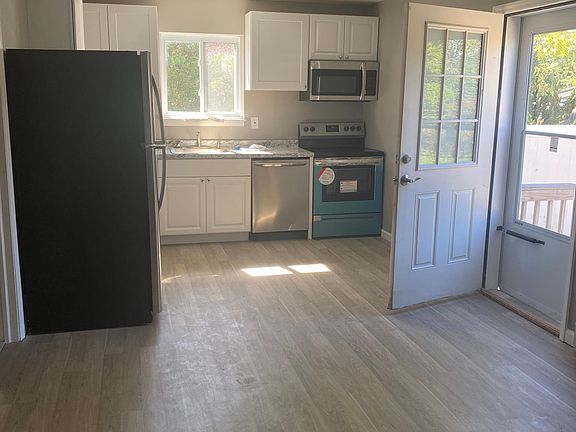 Side entrance. Kitchen with all new appliances & cabinets, brand new flooring